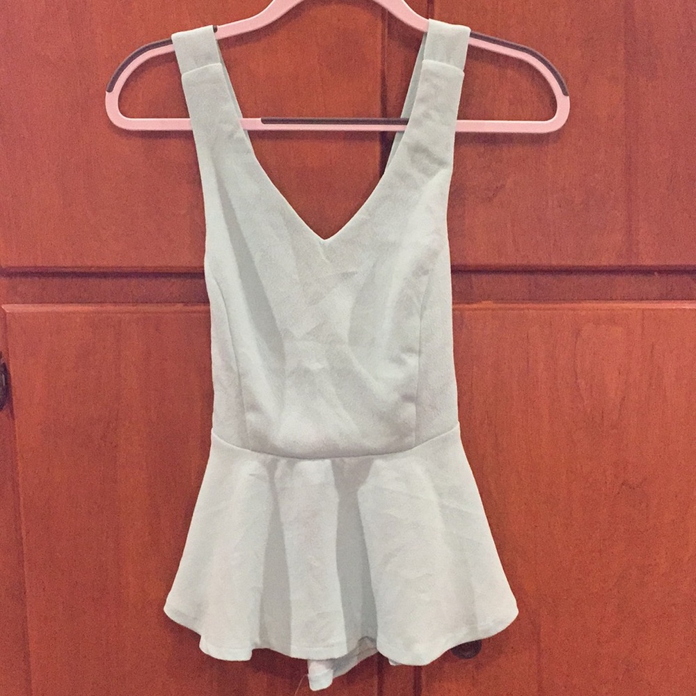 Light blue peplum cross back top